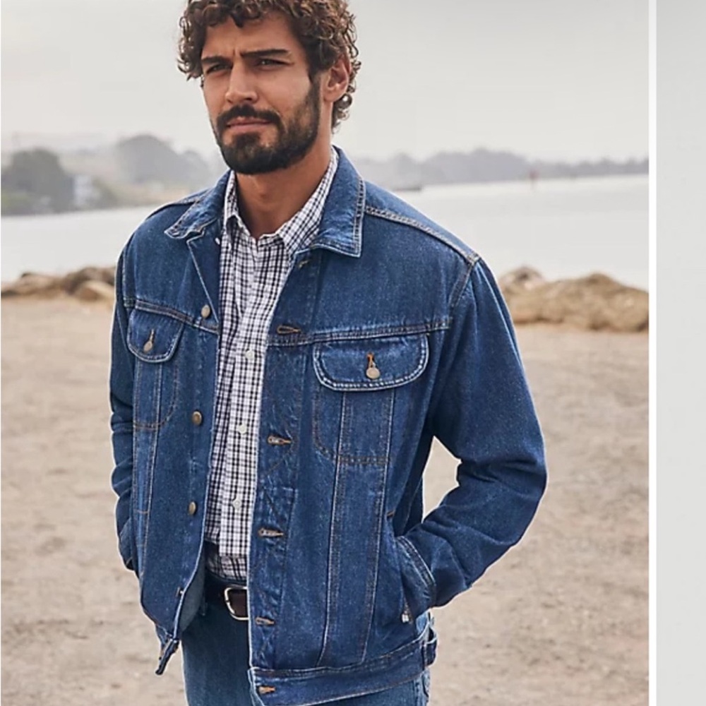 Wrangler Men's Rugged Wear Unlined Denim Jacket in a vintage indigo wash.